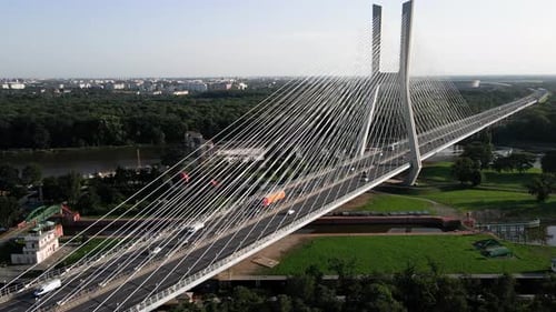 Aerial View of Car Traffic on Modern Cablestayed Bridge Over River