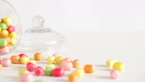 Food, Confectionery and Sweets Eating Concept - Close Up of Scattered Candy