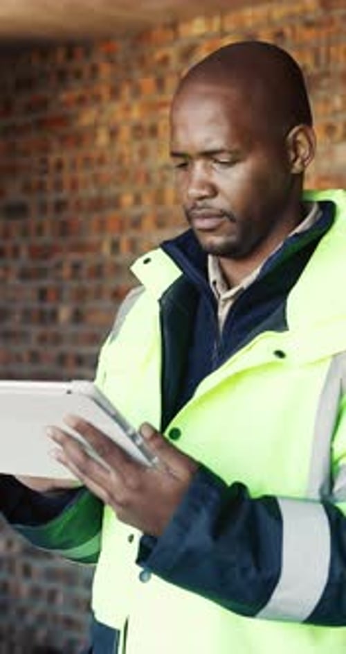 Typing, architecture and black man with tablet for planning construction project