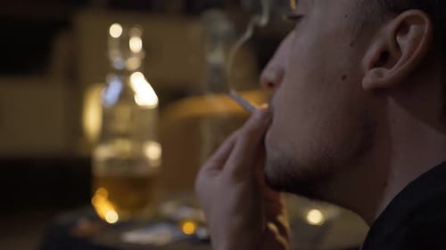 Young man smoking marijuana.