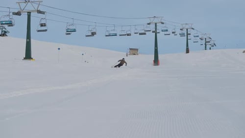 Skier Skiing Down Resort Snow Slope