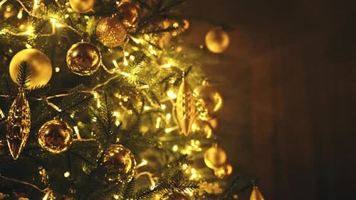 Decorated Christmas Tree with Golden Ornaments and Lights