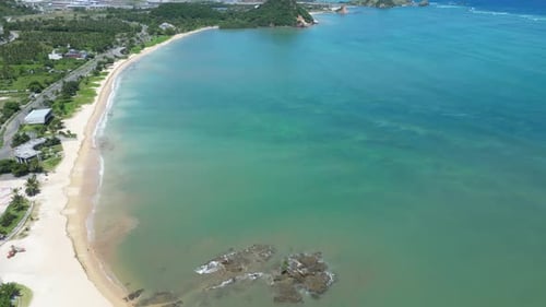 A white sandy beach on the south coast of Lombok, Indonesia. Aerial.