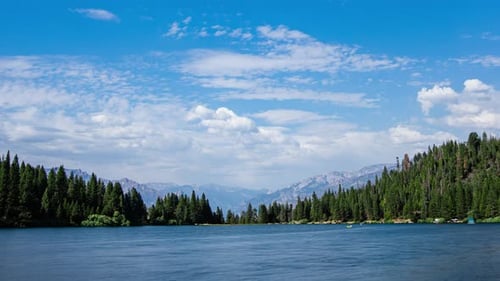 Time Lapse - Panoramic view of tranquil lake with beautiful clouds