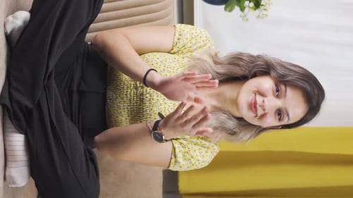Woman Clapping and Giving Thumbs Up Indoors