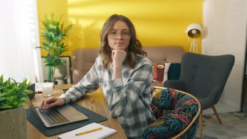 Woman working on laptop in home office