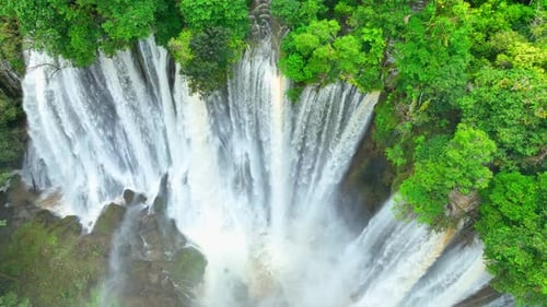 Aerial view: Rainforest waterfall paradise. 4K.