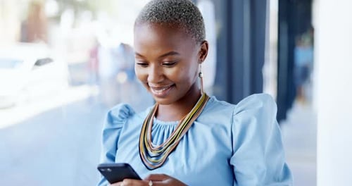 Typing, phone and black woman laughing in office, texting or web browsing on social media