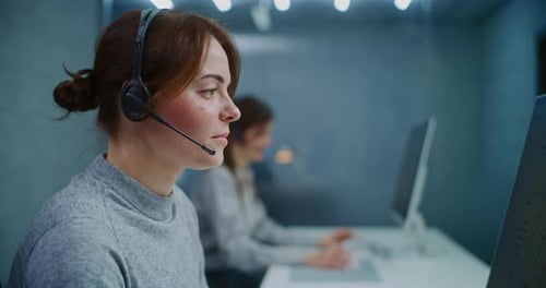 Woman with Headset Working in Office
