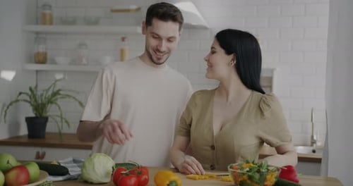 Couple Preparing Food Together in a Bright Kitchen