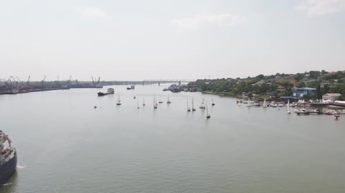 A Serene and Picturesque River View Featuring Boats Surrounded By Lush Greenery and Nature