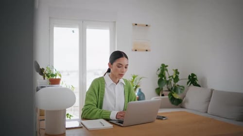 Businesswoman Working Kitchen Table With Modern Laptop Close Up. Serious Young Remote Worker Look...