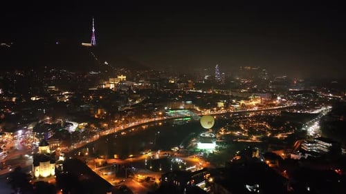 Aerial view of Tbilisi city central park and Bridge of Peace. Beautiful cityscape of old Tbilisi