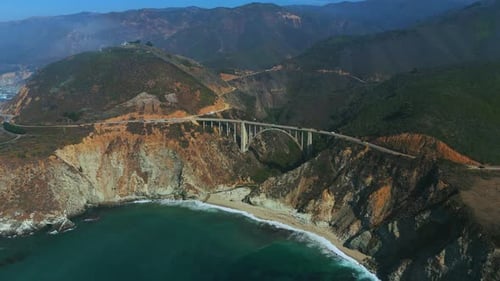 Famous Bixby Bridge at Big Sur, Highway One in California with fog. Aerial