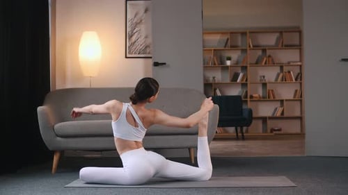 Attractive Woman Doing Yoga Stretch at Home