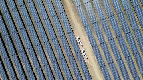 Solar panel field generating renewable electricity, aerial shot, climate change action