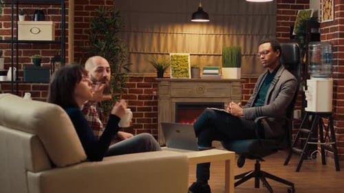 Couple Talking with Therapist in Office Setting