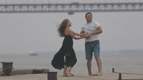 A Romantic Married Couple Dancing on the Pier
