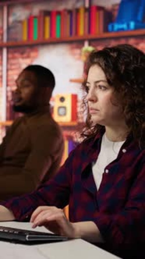 Vertical Video Smiling Woman Using Programming Languages on PC in IT Startup Office