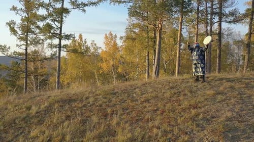 Shaman Performing Ceremony in Autumn Forest