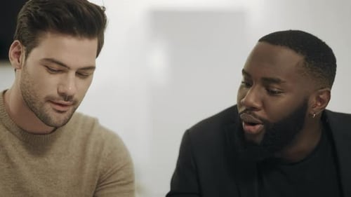 Happy Men in Workplace Give High Five