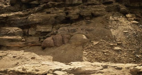 Large Rock Formations are Visible at a Remote Desert Location During Daytime