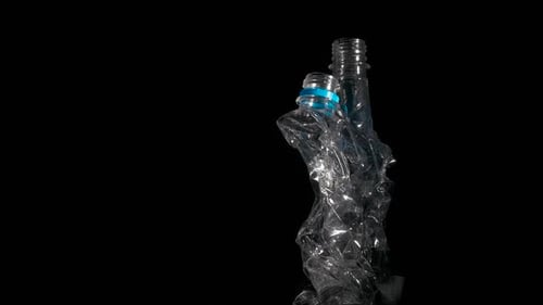 Crushed Plastic Bottles Symbolizing Pollution and Waste
