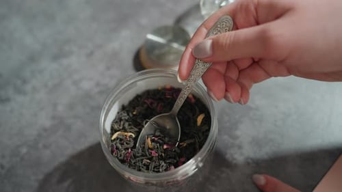 Serene Scene Of Glass Teapot With Loose Tea Leaves Brewing Intimate View Of Steaming Teapot With