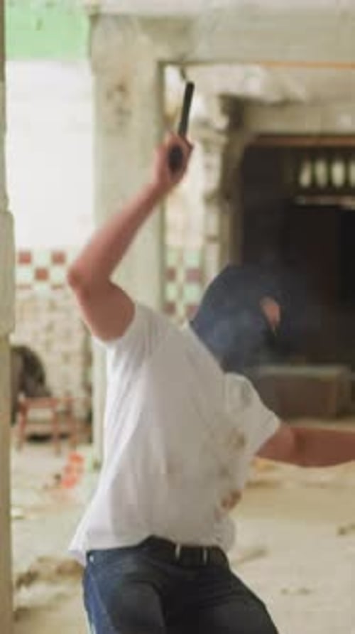 Man with Ski Mask Raises Knife, Throws Rock