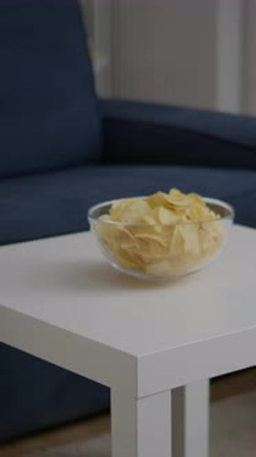 Vertical Video Closeup of Junk Fried Potato Bowl Put on Woden Table in Empty Party Room