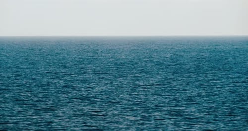 View of beautiful blue Ocean during a sunny day. Waves are calm