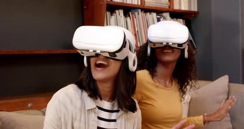 Women Exploring Virtual Reality Together Indoors