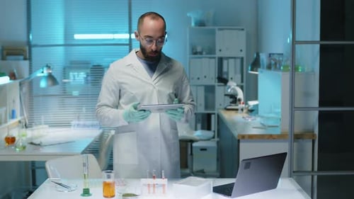 Portrait of Male Scientist with Tablet Computer in Lab