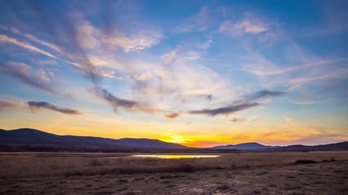 View of the Sunset Sky with Clouds Over the Balkan Mountains and the Black Sea Bay Near the Beach