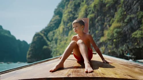 Happy Caucasian Child Traveling to Thailand Little Boy Sitting on Longtail Boat Carefree Childhood