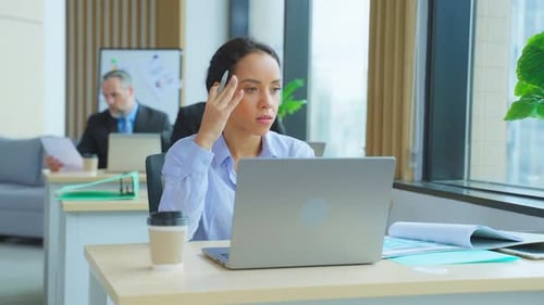Latino young beautiful businesswoman working in the office workplace.