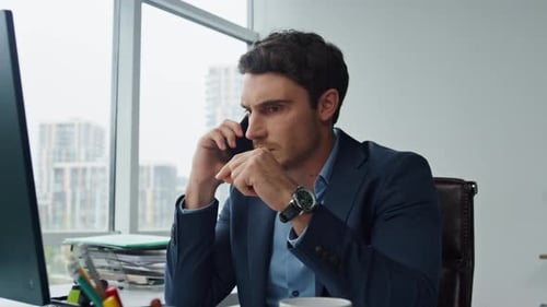 Businessman talking on the phone in a modern office
