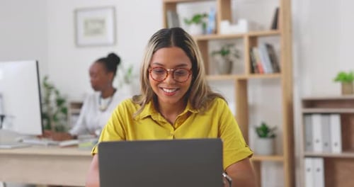 Laptop, typing and female working in the office doing research for a creative marketing project