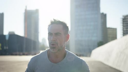 Middleaged Caucasian Man Running Alone in an Urban Area Disciplined Male Workout Burning Calories