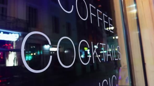 The Cafes Window Display Features Colorful Cocktails and EyeCatching Music Signage Shining Brightly