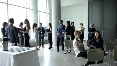Business Conference Attendees Talking in Convention Center