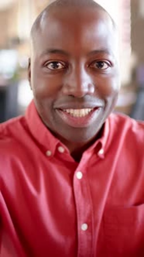 Close Up of Smiling Man Talking to Camera