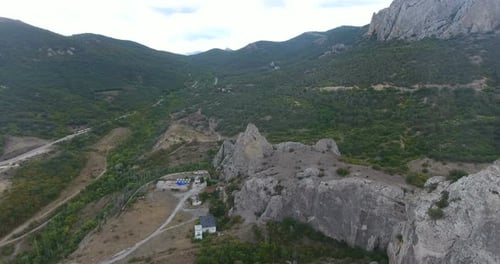 Top View of Mountain Peaks and Forest