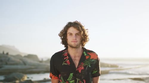Fashion, summer and face of man on beach for vacation, holiday and travel for sightseeing outdoor