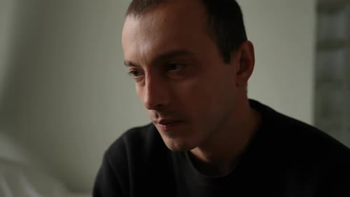 Man in Deep Thought Indoors