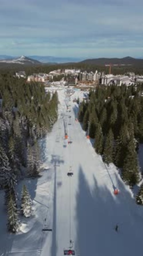 Alpine Ski Lift Aerial Drone View in Kopaonik Serbia Chairlift at Ski Resort Mountain Winter Forest