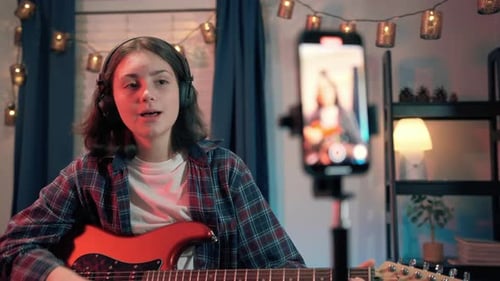 Close Up Shot of Art Woman Bloggers Online Lesson Recording Playing Guitar