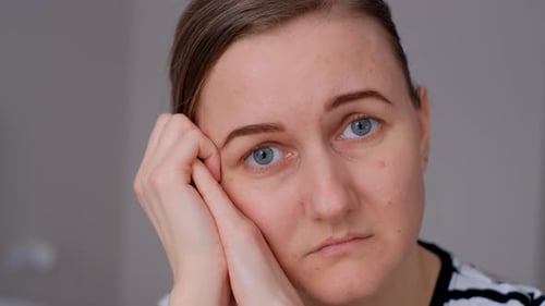 Closeup of a Sad Pensive Young Woman Sitting Alone Thinking About Relationships Personal Problems