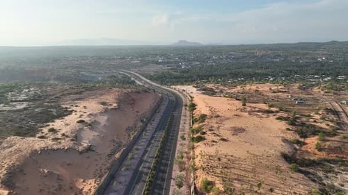 Desert Road Connects Nature to Distant Town