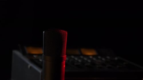 Microphone in the studio on the air with a mixing board